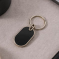 Elegant Black & Silver Oval Metal Keychain (1 Pc) - dailyneed.life